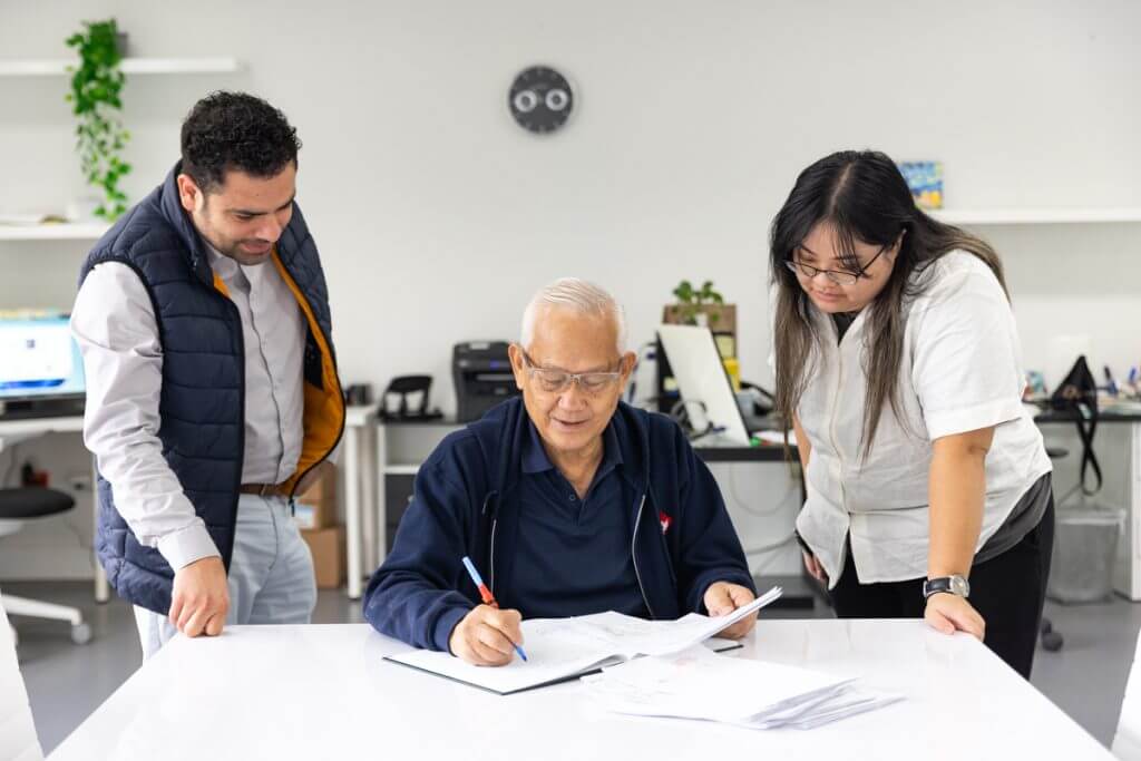 Research team reviewing peptide synthesis documentation